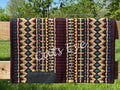 Hand-woven western show pad with a dark chocolate brown base featuring geometric diamond patterns in sandy tan, vibrant teal, and gold yellow accents with black wear leathers.